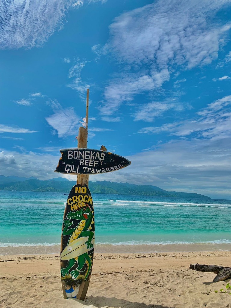 Bongkas Reef Gili Trawangan surfboard sign on the beach