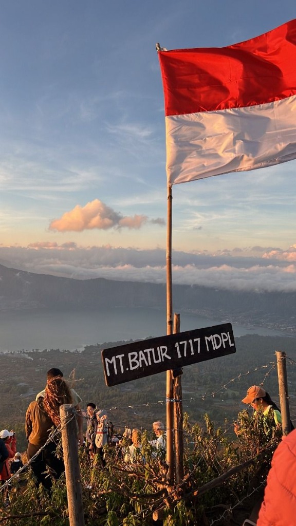 Mount Batur Summit 1717 MDPL sign with Indonesian flag